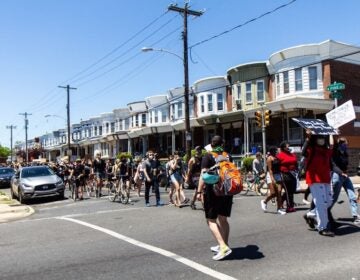 Protesters in West Philadelphia marched from the site of the MOVE bombing to Malcolm X park in protest of racial injustice. (Kimberly Paynter/WHYY)