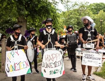 The Positive Movement Entertainment drill team leads a protest