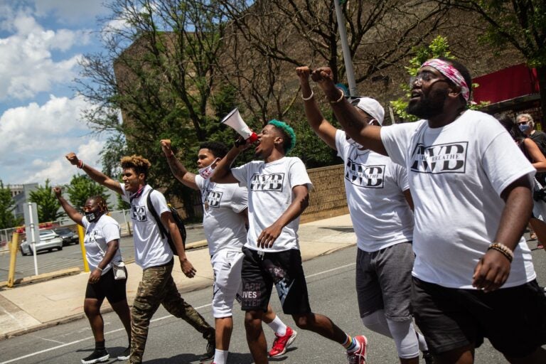 Nasir Bell (on the bullhorn) chants “I will breathe” at a protest march on Juneteenth. Bell, 22, started his organization, I Will Breathe, will other protesters he met during his arrest at a protest in Philadelphia on June 1. (Kimberly Paynter/WHYY)