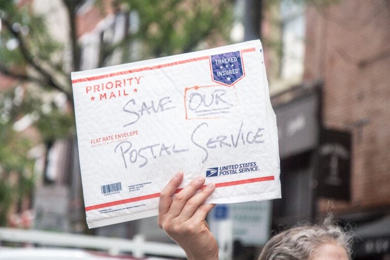 The American Postal Workers union local 89 and other labor supporters protest in Old City demanding the postal service be fully funded. (Kimberly Paynter/WHYY)