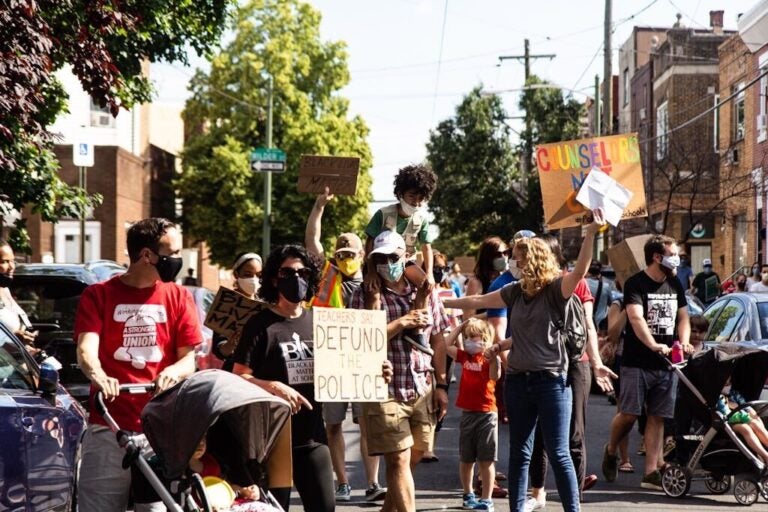 East Passyunk families marched in South Philadelphia Friday demanding justice for George Floyd and Breonna Taylor. (Kimberly Paynter/WHYY)