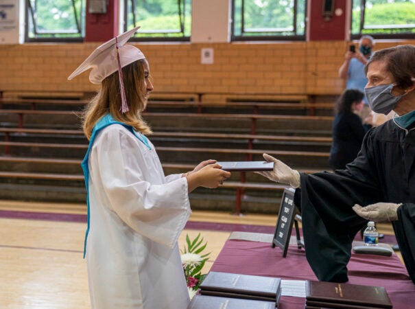 Ashley receives her diploma on graduation day at Little Flower Catholic School for Girls in Hunting Park. (Jessica Kourkounis for Keystone Crossroads)