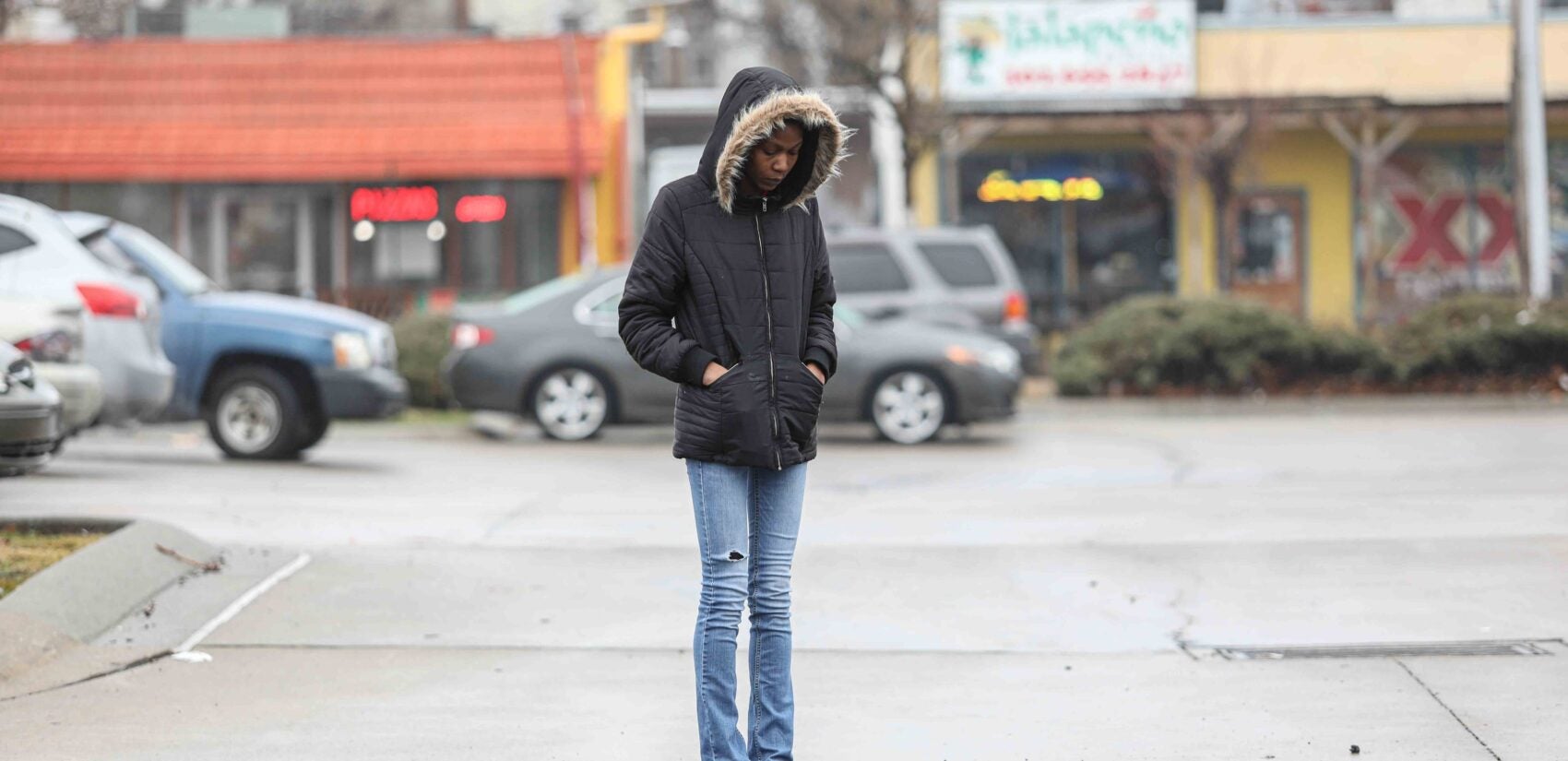 Keandra McDole stands at the spot where her brother Jeremy McDole was shot to death by police. (Saquan Stimpson for WHYY)