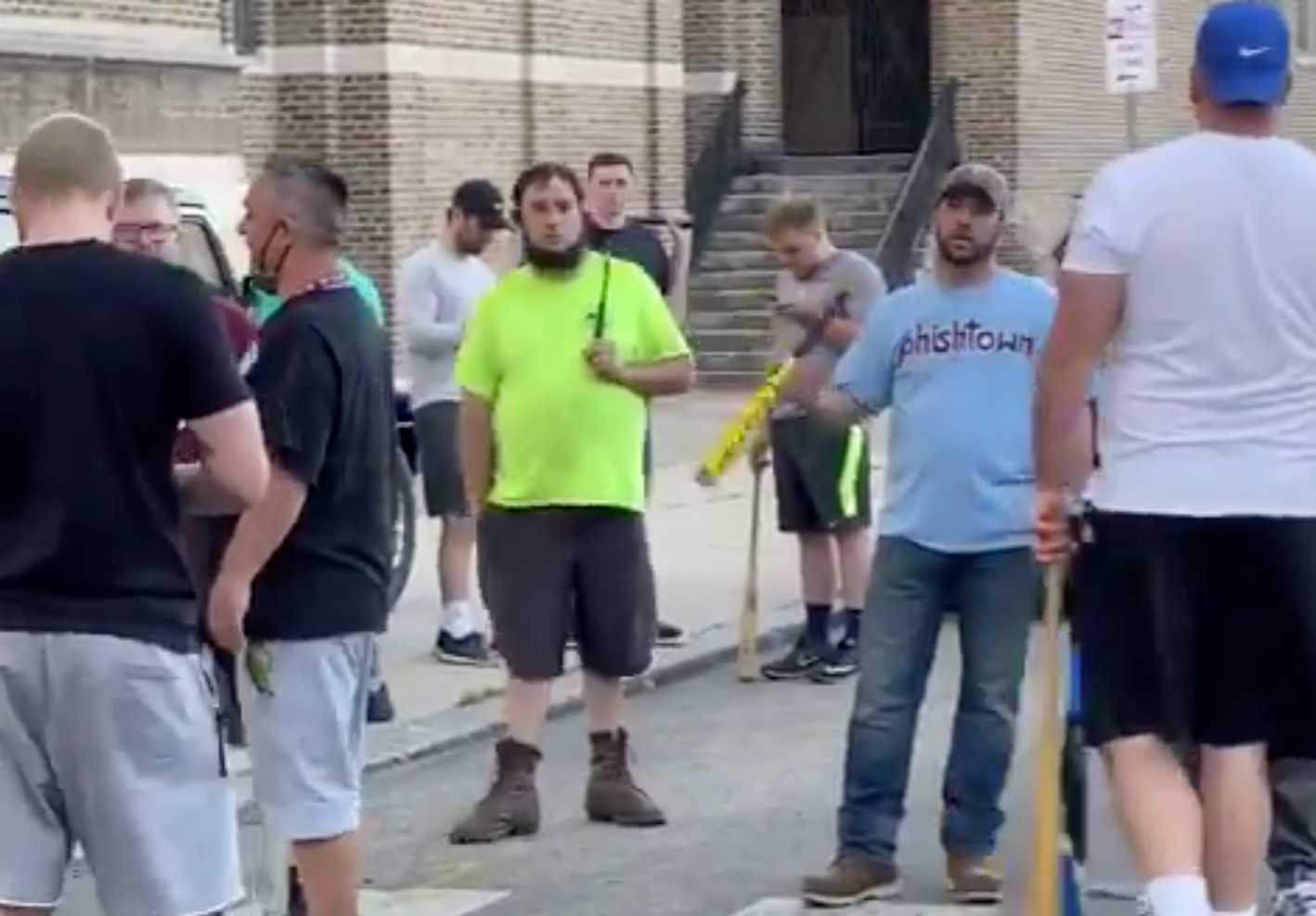 White bat-wielding men in Fishtown, who said they were there to protect police, assaulted at least three people during a protest on Monday. (Screenshot via Twitter)