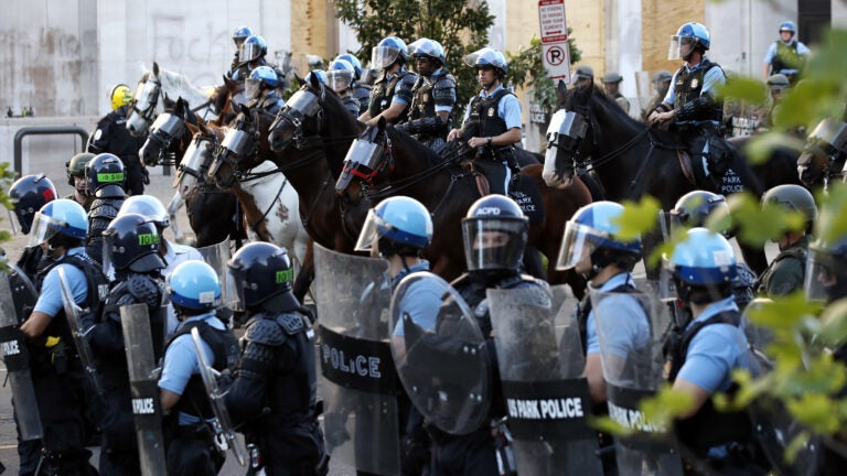 Police gather to remove demonstrators from the area around Lafayette Park and the White House before President Trump's walk to St. John's Church.