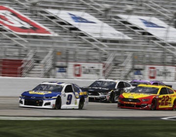 Chase Elliott (9), Aric Almirola (10) and Joey Logano (22) drive during a NASCAR Cup Series auto race at Atlanta Motor Speedway on Sunday in Hampton, Ga. On Wednesday, NASCAR announced a ban of the Confederate battle flag at all of its events and properties. (Brynn Anderson/AP Photo)
