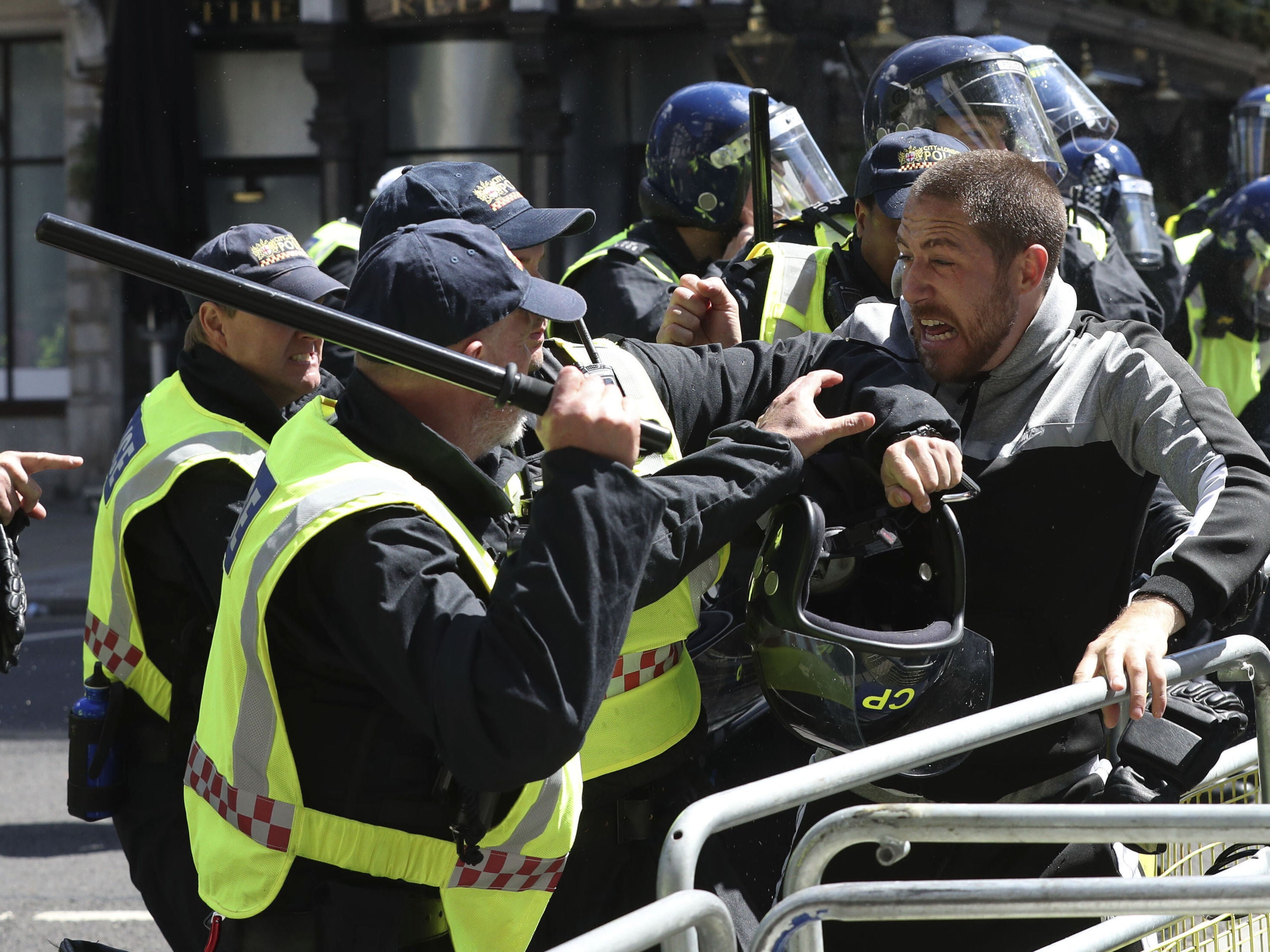 Police confront protesters in Whitehall near Parliament Square in London. The weekend's unrest include "protect our monuments" protesters.