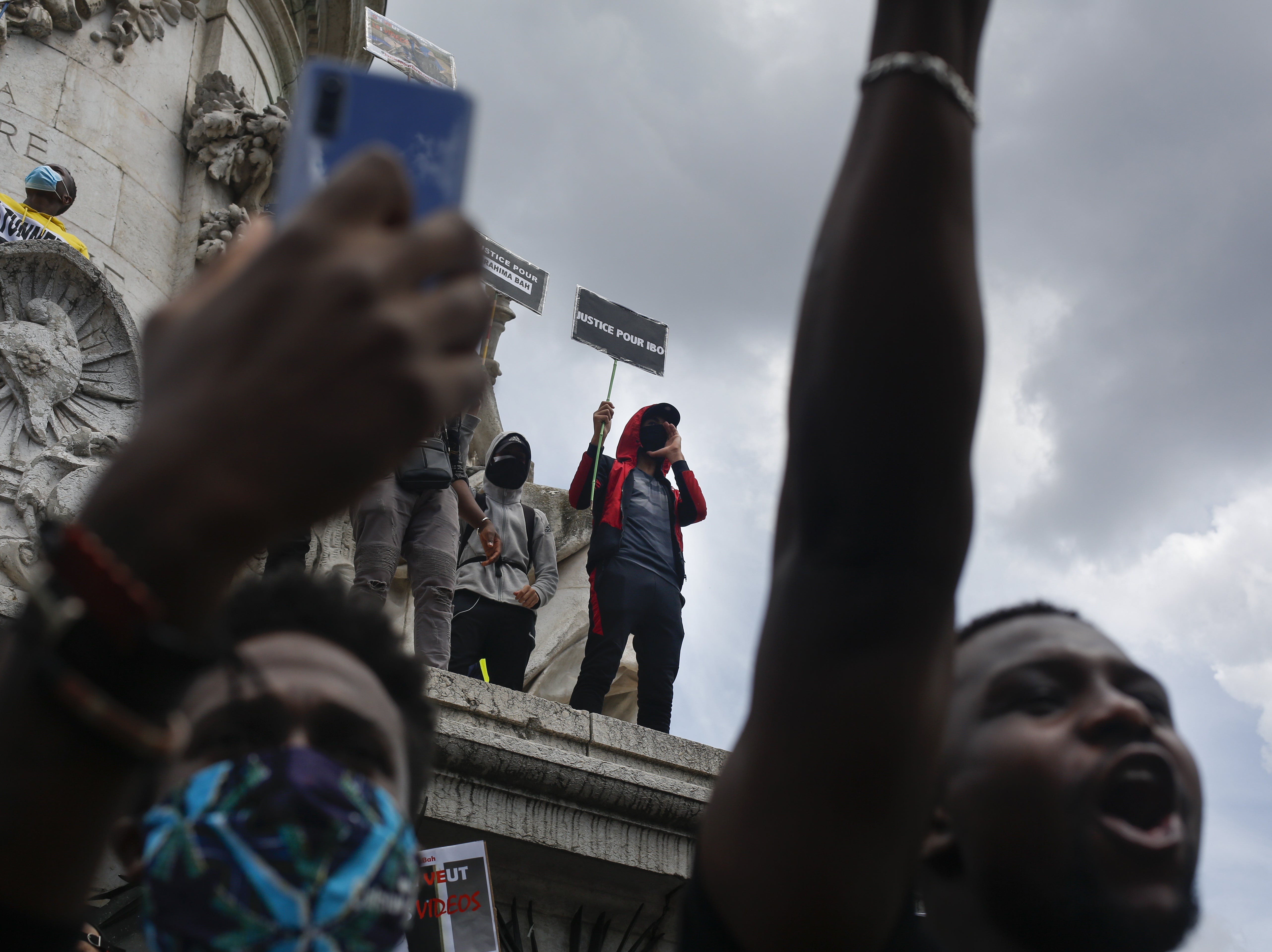 People gather at the Place de la Republique in Paris on Saturday for a march against police brutality and racism.