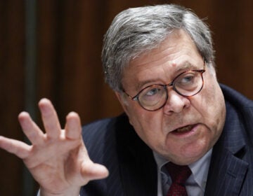 Critics have called Attorney General William Barr too willing to do the bidding of President Trump. Justice Department attorneys say they've seen political pressure in big cases.
Evan Vucci/AP