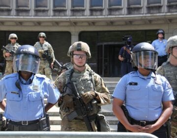 File - National guard troops help protect Philadelphia police headquarters during a series of protests aimed at police brutality. (Emma Lee/WHYY)