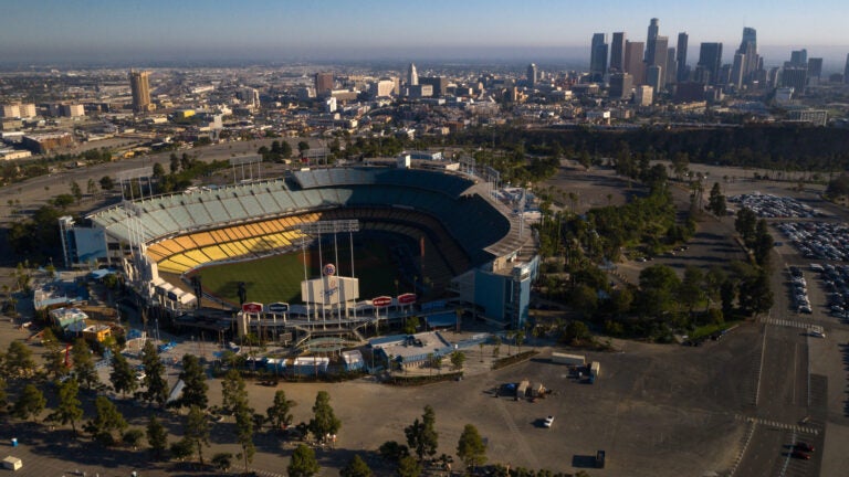 Dodger Stadium in Los Angeles stands empty in an aerial view from late May. Games will resume in late July. (Bing Guan/Bloomberg via Getty Images)