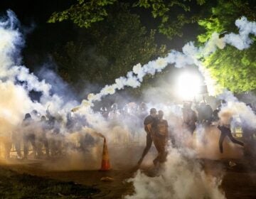 Tear gas rises as protesters face off with police during a demonstration on May 31 outside the White House over the death of George Floyd at the hands of Minneapolis Police. (Samuel Corum/AFP via Getty Images)