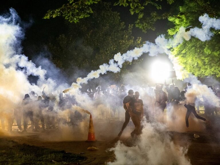 Tear gas rises as protesters face off with police during a demonstration on May 31 outside the White House over the death of George Floyd at the hands of Minneapolis Police. (Samuel Corum/AFP via Getty Images)