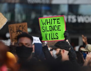 White Fragility author Robin DiAngelo says the question white people should be asking themselves is not: Have I been shaped by race, but how have I been shaped by race? Above, protesters at a 