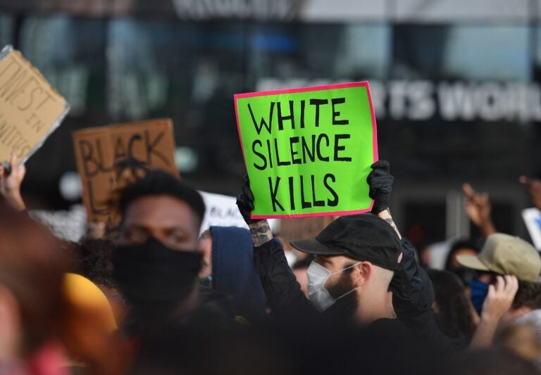 White Fragility author Robin DiAngelo says the question white people should be asking themselves is not: Have I been shaped by race, but how have I been shaped by race? Above, protesters at a 