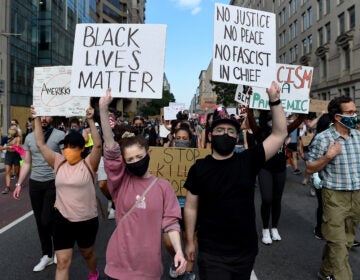Demonstrators march near the White House on Thursday, protesting the death of George Floyd in Minneapolis police custody. (Olivier Douliery/AFP via Getty Images)