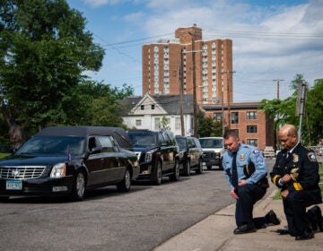 Minneapolis Police Chief Medaria Arradondo (right) kneels as the hearse of George Floyd arrives to North Central University ahead of funeral service on Thursday. Protests in the wake of Floyd's death while in police custody has erupted across the country.
(The Washington Post/The Washington Post via Getty Images)