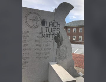Someone spray painted 'Black Lives Matter' on a memorial dedicated to state police troopers killed in the line of duty located outside State Police headquarters in Dover. (Courtesy of Delaware State Police)