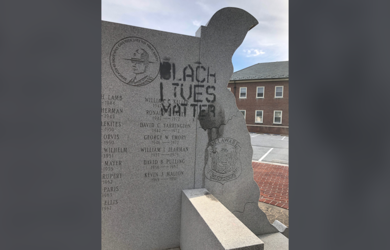 Someone spray painted 'Black Lives Matter' on a memorial dedicated to state police troopers killed in the line of duty located outside State Police headquarters in Dover. (Courtesy of Delaware State Police)