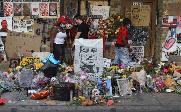 People gather on June 3, at the site where George Floyd, an African-American man, was killed while in the custody of the Minneapolis Police Department.