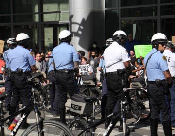 Protesters at the Pennsylvania Convention Center urge police to ‘take a knee in solidarity' on Monday, June 1, 2020. (Emma Lee/WHYY)