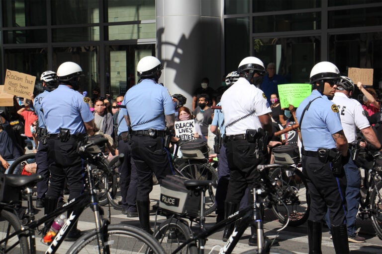 Protesters at the Pennsylvania Convention Center urge police to ‘take a knee in solidarity' on Monday, June 1, 2020. (Emma Lee/WHYY)