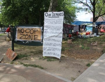 Von Colln Field on the Benjamin Franklin Parkway has become home to more than 200 people protesting Philadelphia's treatment of its homeless population. (Emma Lee/WHYY)