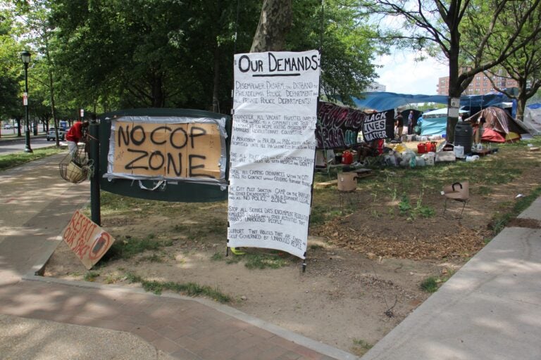 Von Colln Field on the Benjamin Franklin Parkway has become home to more than 200 people protesting Philadelphia's treatment of its homeless population. (Emma Lee/WHYY)