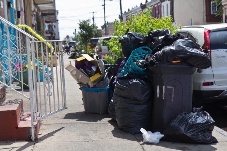 Some city residents say they are fed up with delayed trash collection. The city says sanitation workers are worked harder than ever, due to more people staying home and making more trash. (Kimberly Paynter/WHYY)