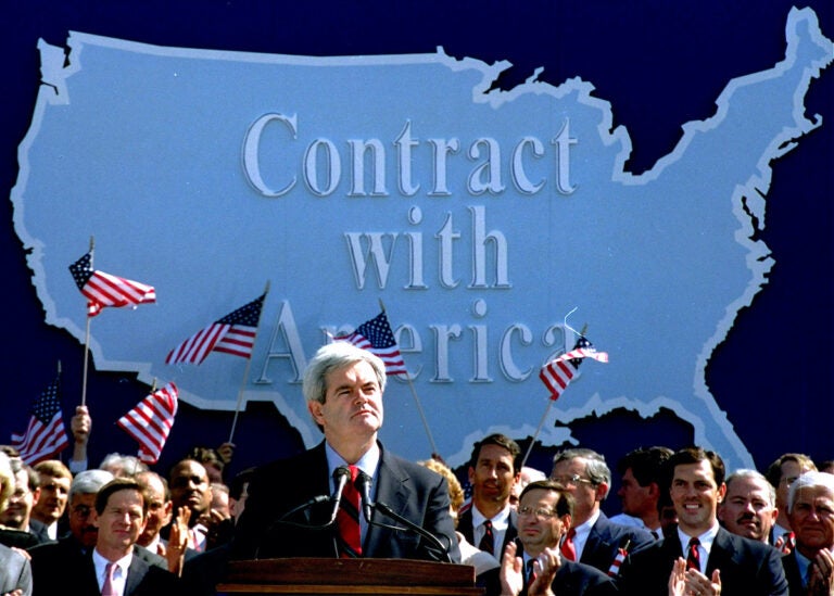 In this Sept. 27, 1994 photo, then-House Minority Whip Newt Gingrich of Ga., pauses while speaking to Republican congressional candidates on Capitol Hill during a rally where they pledged a 