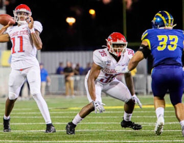 August 30, 2019, Newark, Delaware, U.S: Delaware State quarterback SHAYNE SMITH (11) attempts a pass to the end zone during a week one game between the Delaware Blue Hens and Delaware State Thursday, AUG. 29, 2019, at Tubby Raymond Field at Delaware Stadium in Newark, DE. (Credit Image: © Saquan Stimpson/ZUMA Wire) (Cal Sport Media via AP Images)