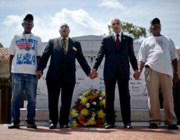 In this Wednesday, April 4, 2012 file photo, civil rights activists and Southern Christian Leadership Conference members from left, Ralph Worrell, Dr. Bernard Lafayette, Jr., C.T. Vivian and Frederick Moore, join hands and sing 