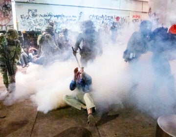 Federal officers use chemical irritants and crowd control munitions to disperse Black Lives Matter protesters outside the Mark O. Hatfield United States Courthouse on Wednesday, July 22, 2020, in Portland, Ore. (AP Photo/Noah Berger)