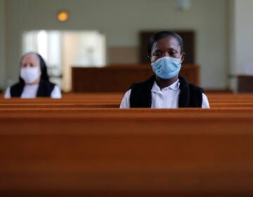 Faustina Bema, a candidate for Novice of the Sisters of the Holy Family, prays inside a chapel during a retreat at their Mother House in New Orleans, Thursday, July 23, 2020. (AP Photo/Gerald Herbert)