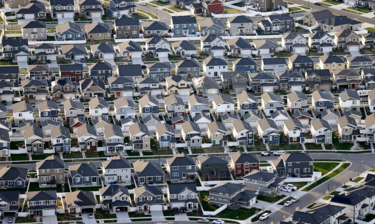 This April 13, 2019, file photo, shows rows of homes, in suburban Salt Lake City.  (AP Photo/Rick Bowmer)