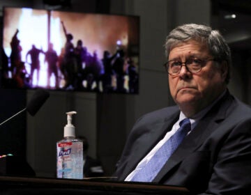 U.S. Attorney General William Barr watches a Republican Exhibit video of people rioting, during a the House Judiciary Committee hearing July 28, 2020 in Washington, DC. In his first congressional testimony in more than a year, Barr is expected to face questions from the committee about his deployment of federal law enforcement agents to Portland, Oregon, and other cities in response to Black Lives Matter protests; his role in using federal agents to violently clear protesters from Lafayette Square near the White House last month before a photo opportunity for President Donald Trump in front of a church; his intervention in court cases involving Trump's allies Roger Stone and Michael Flynn; and other issues. (Photo by Chip Somodevilla/Getty Images)