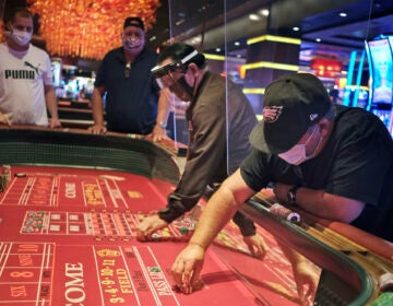 Craps players and dealers are seperated by partitions at the Golden Nugget Casino
