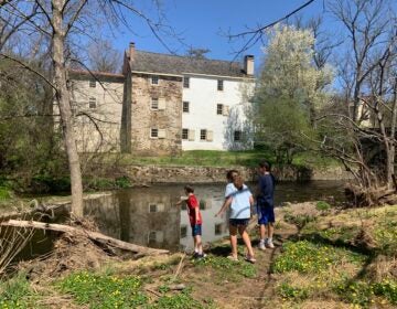 Kids exploring the Wissahickon creek near the historic Evans-Mumbower Mill. (Photo by Julie Watt)