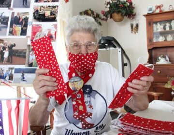 Mae Krier is busy sewing face masks in the ‘Rosie the Riveter’ pattern at her home in Levittown, Pa. (Emma Lee/WHYY)