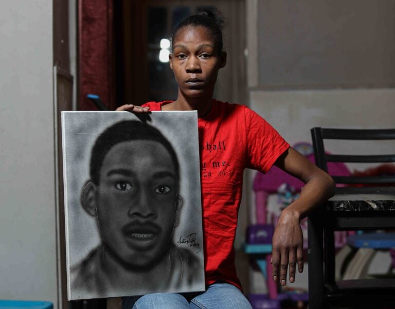Keandra McDole stands with a sketch of her brother, Jeremy
