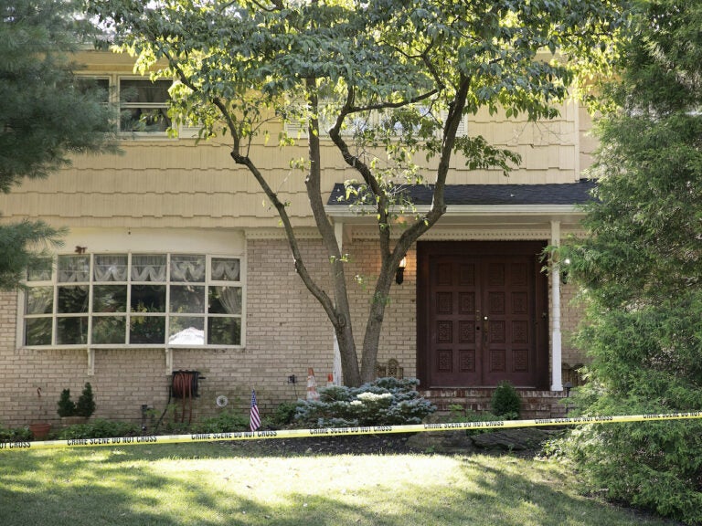 Crime scene tape surrounds the home of U.S. District Judge Esther Salas