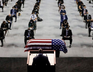 The Rev. Darryl Caldwell speaks as the casket of the late Rep. John Lewis, D-Ga., lies in repose during a service at Troy University in Troy, Ala., on Saturday.