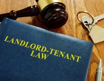 Landlord Tenant Law book and key from home. (Courtesy of BigStock)