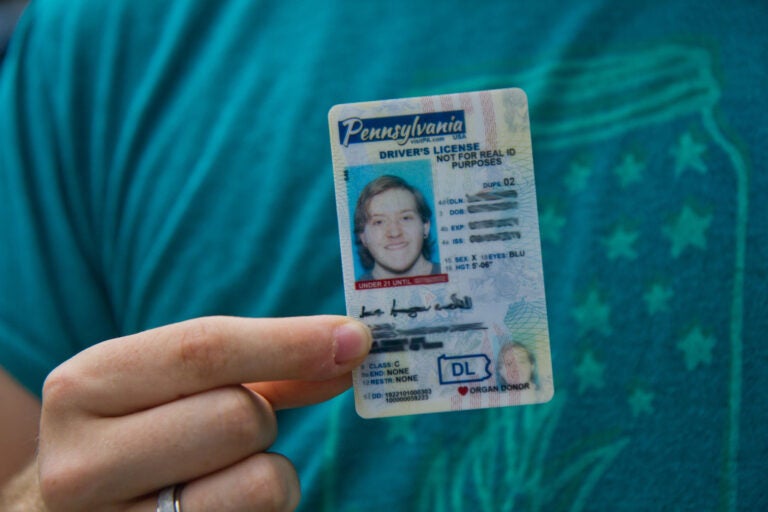 Finn Nahill holds a new drivers license, which uses the gender-neutral designation 