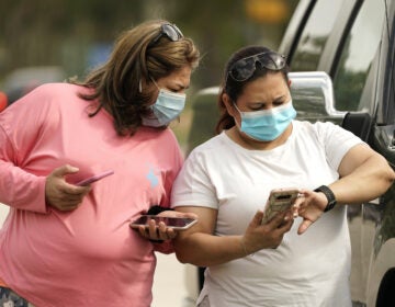Women wear masks in Houston on Wednesday. Harris County requires any business providing goods or services to require all employees and visitors to wear face coverings in areas of close proximity to co-workers or the public, at least through Aug. 26.
