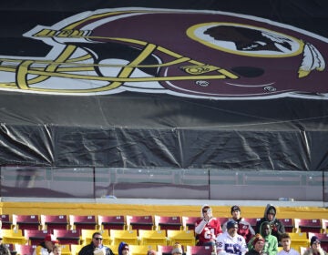 Fans sit in the stands before the start of a game between the New York Giants and Washington Redskins at FedEx Field in 2019 in Landover, Md. The Redskins, and other teams, are reviewing their names. (Patrick McDermott/Getty Images)