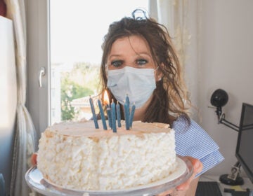Birthday spoiler alert: If you want your mask to be a barrier to coronavirus transmission, you should not be able to blow out candles while wearing it. (Florin Cristian Ailenei/EyeEm via Getty Images)