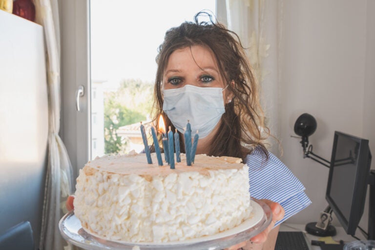 Birthday spoiler alert: If you want your mask to be a barrier to coronavirus transmission, you should not be able to blow out candles while wearing it. (Florin Cristian Ailenei/EyeEm via Getty Images)