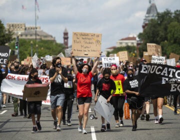 Black Students Matter demonstrators march en route to a rally at the Department of Education in Washington, D.C., on June 19.