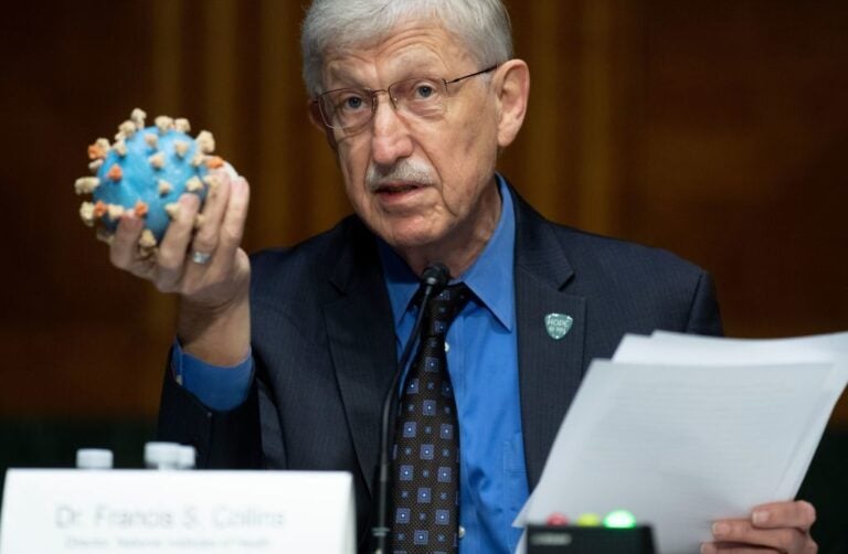 Director of the National Institutes of Health, Dr. Francis Collins, holds a model of the coronavirus as he testifies at a US Senate hearing to review Operation Warp Speed: the researching, manufacturing, and distributing of a safe and effective coronavirus vaccine, in Washington, DC, on July 2, 2020. (Saul Loeb/Pool/AFP via Getty Images)